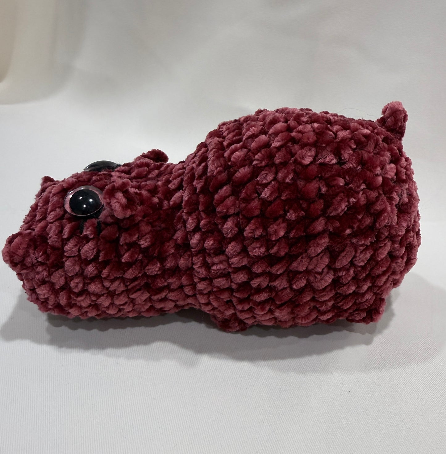 crochet plush hippo on a white background