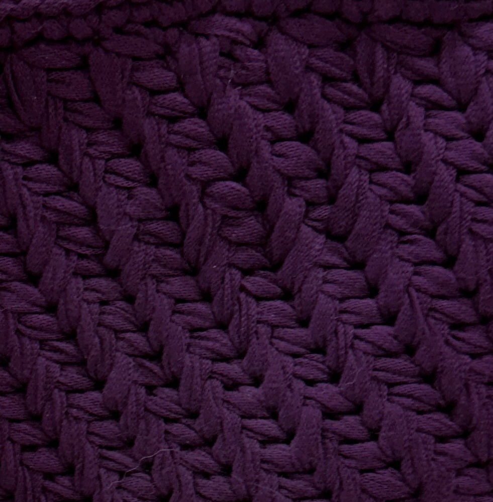 Close-up of plum crochet purse pattern