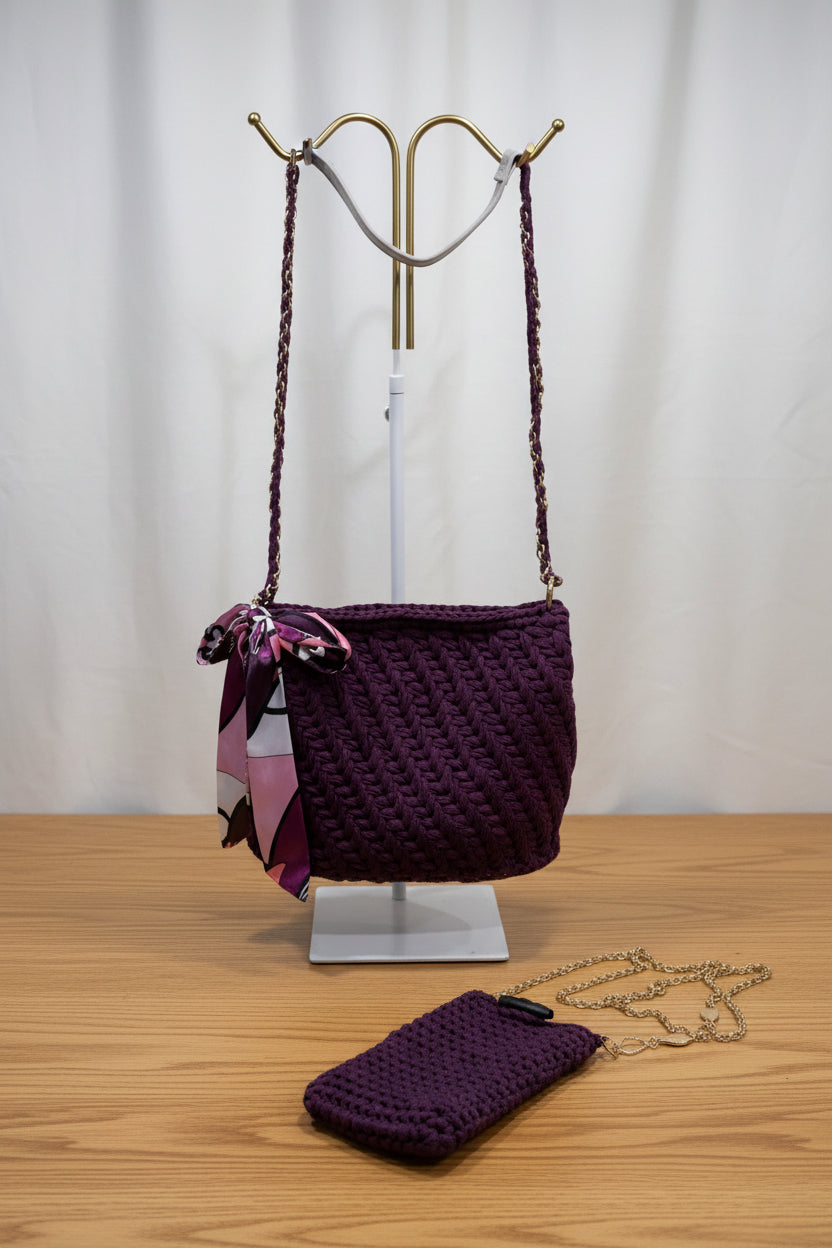 Plum crochet handbag with a smaller matching cell phone pouch on a white background
