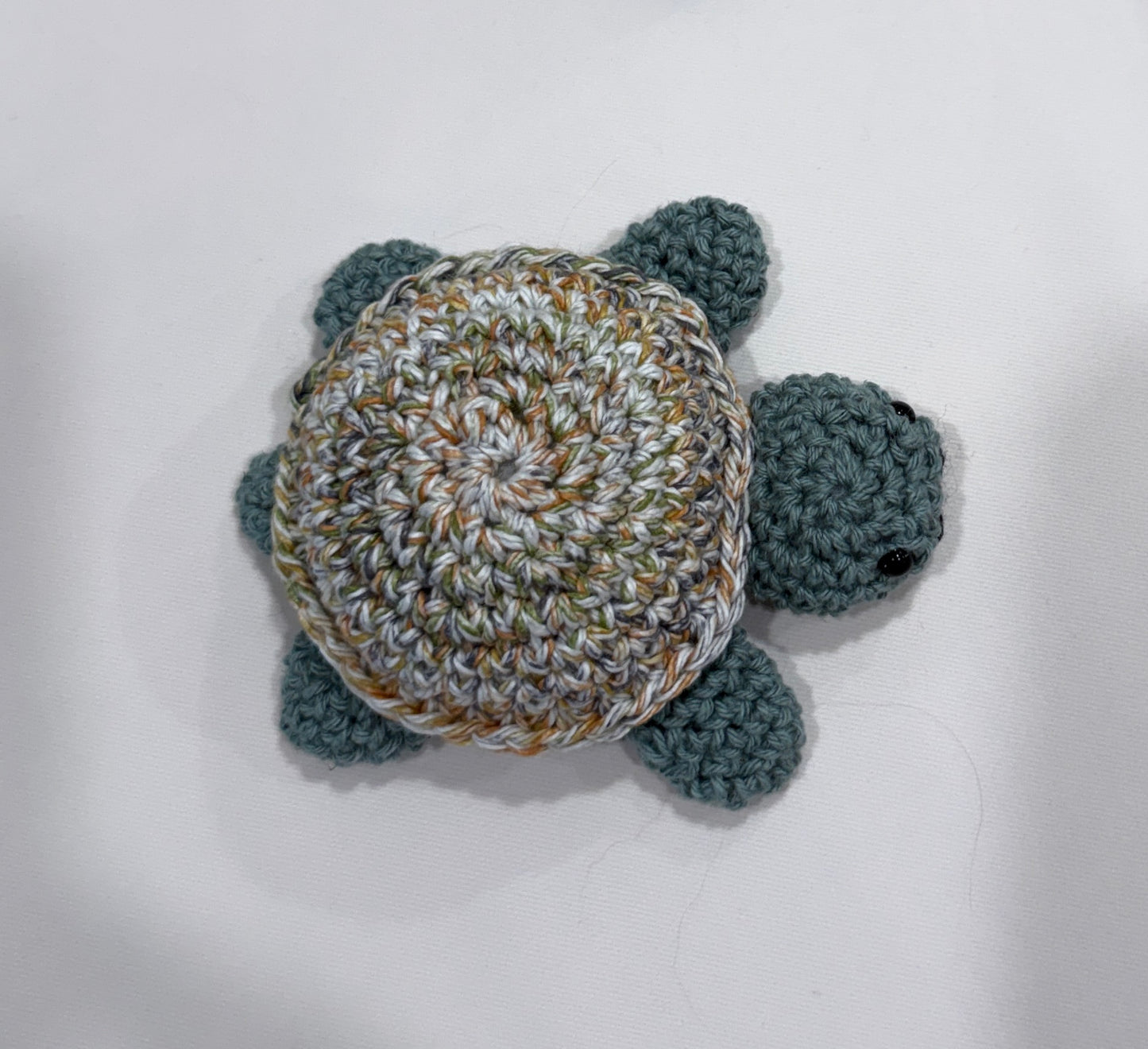 Crocheted turtle on a white background