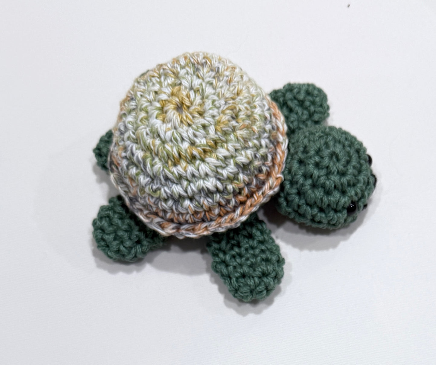 Crocheted turtle on a white background