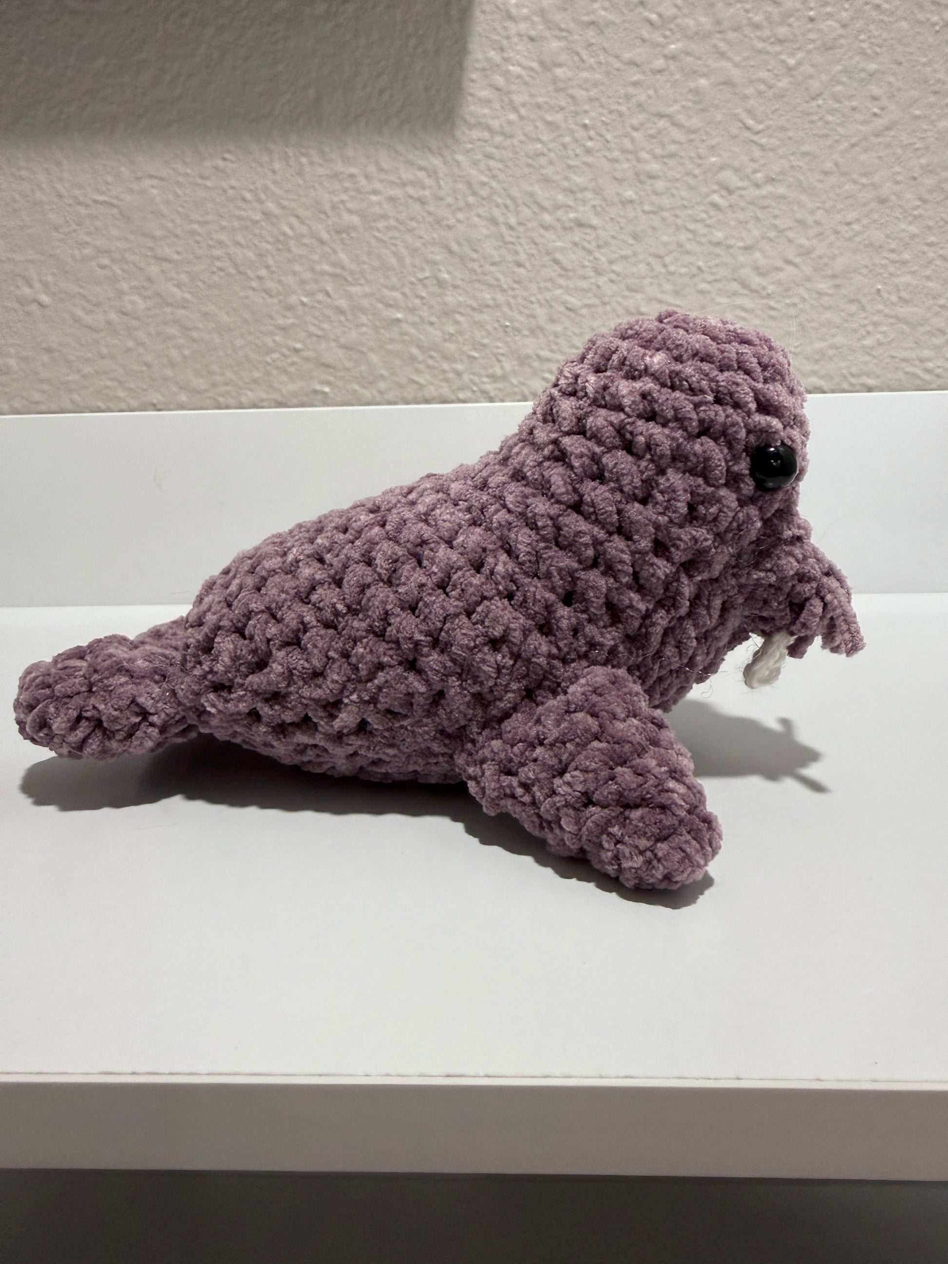 Side view of dusty lavender crochet walrus